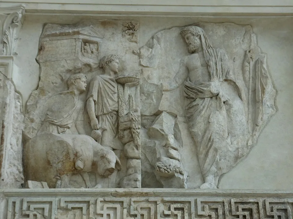 Sacrifice relief on the west front of the Ara Pacis, 13–9 BC — the elder sacrificing before a shrine of the Penates has long been read as Aeneas arriving at Lavinium, though some identify him as Numa