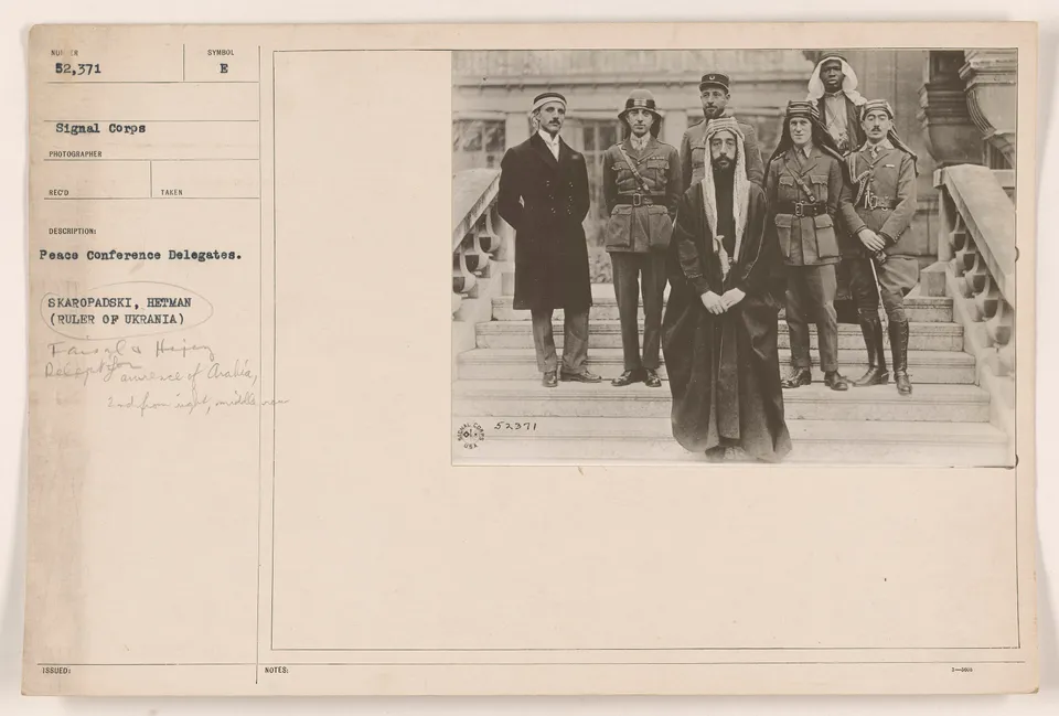 Faisal (front centre) and his party at the Paris Peace Conference, T. E. Lawrence among them, 1919