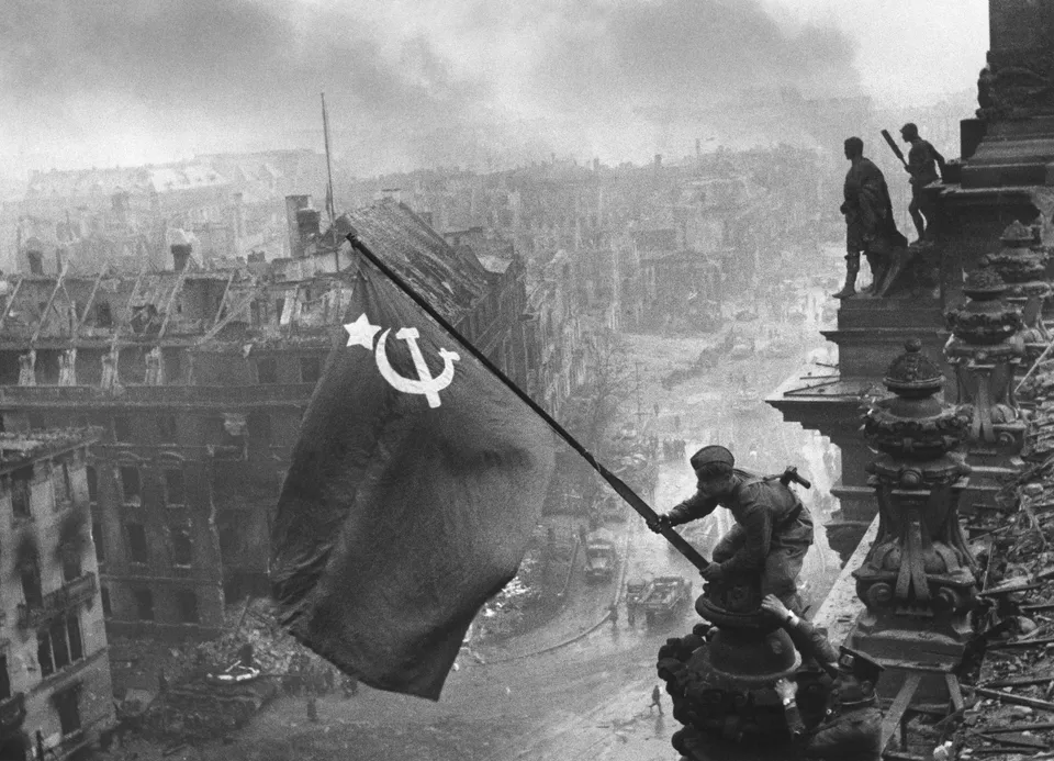 “Raising a Flag over the Reichstag” — Yevgeny Khaldei, 2 May 1945