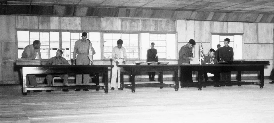 Lt. Gen. William Harrison (UN) and Nam Il (KPA/CPV) signing the armistice at Panmunjom, 27 July 1953