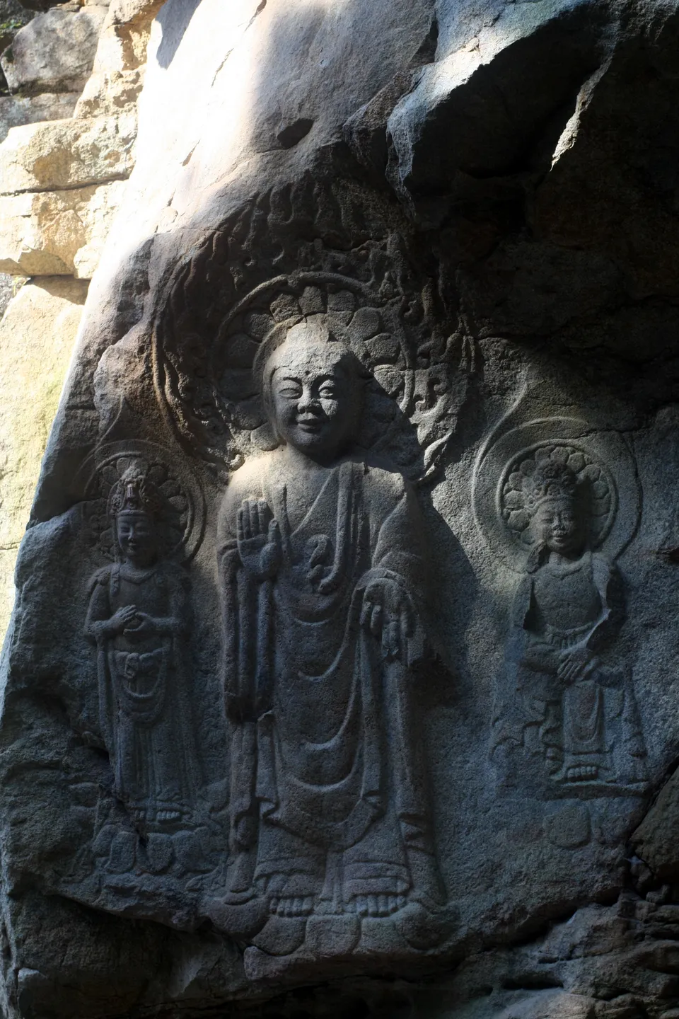 Rock-carved Buddha triad at Yonghyeon-ri, Seosan — the central Buddha known for the "smile of Baekje"