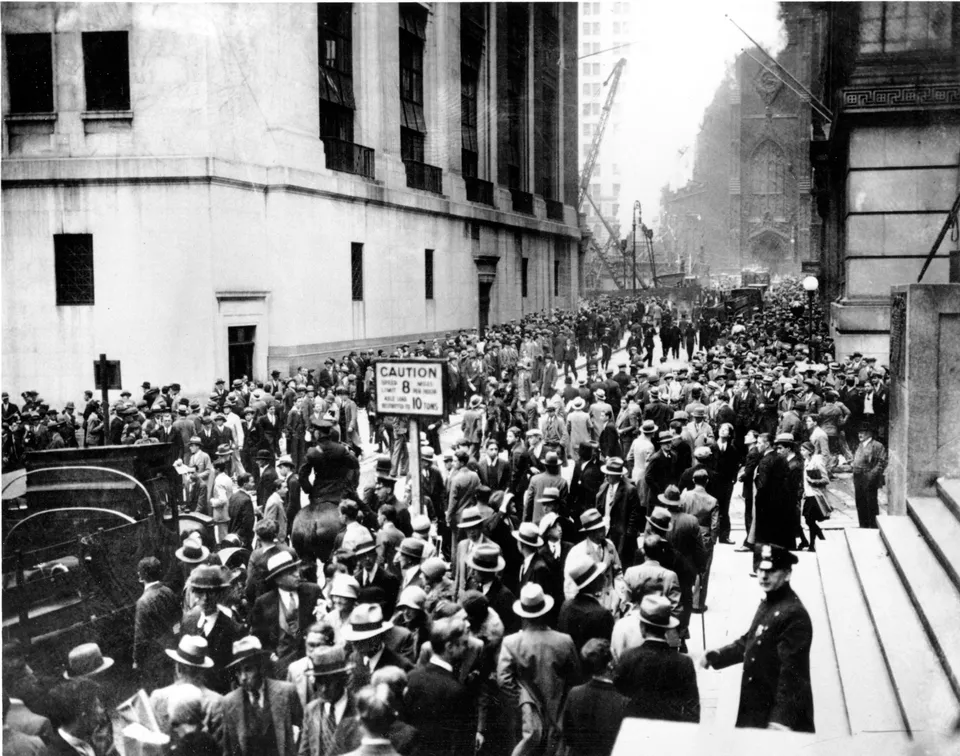 Crowds gather on Wall Street as the market crashes, New York, 24 October 1929